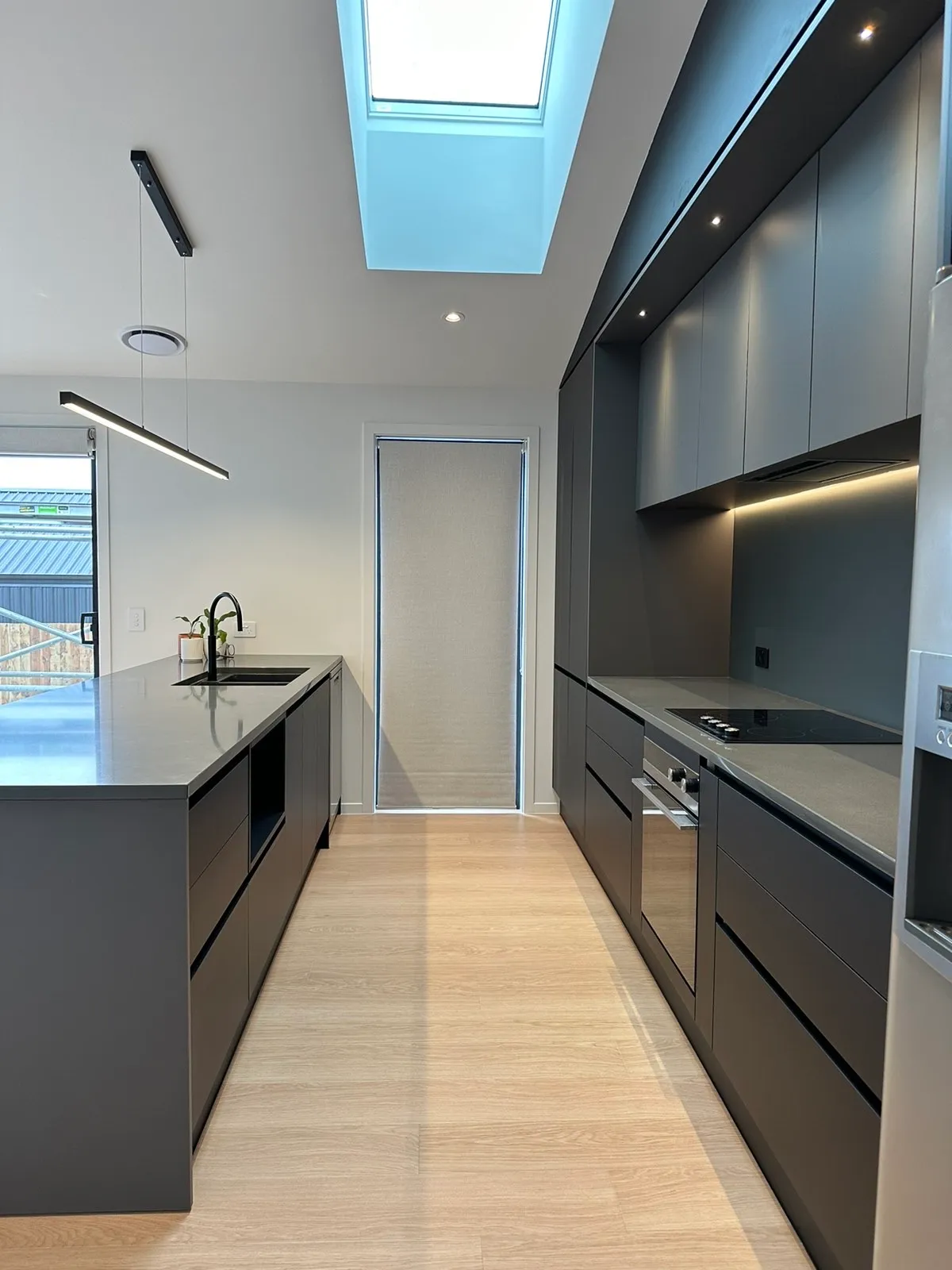 Charcoal galley with LED-lit overheads under a skylight
