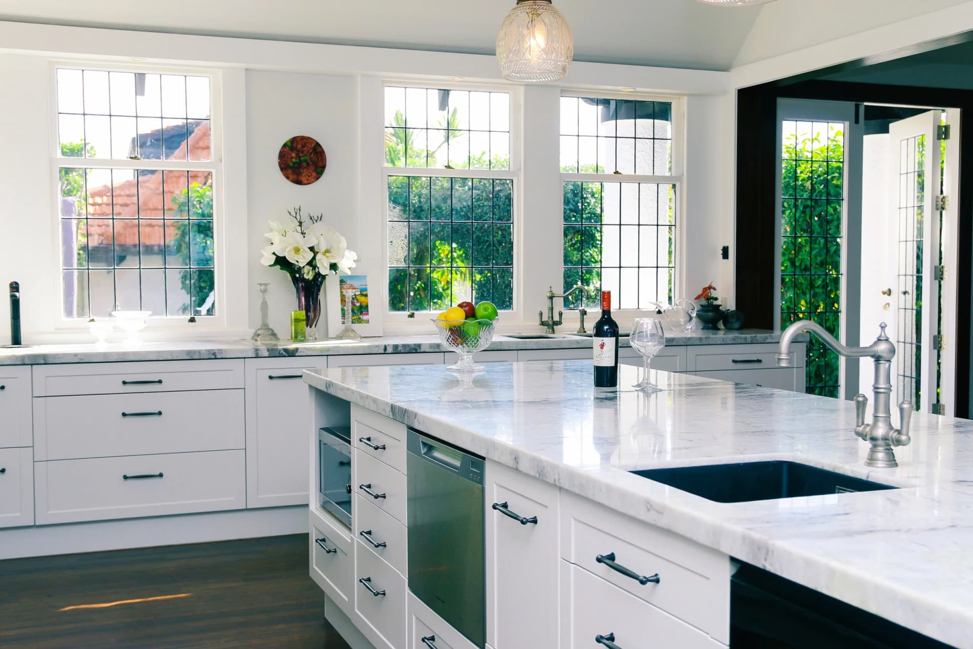 Modern kitchen with brushed brass tapware and stone benchtop, Inspire Kitchens NZ