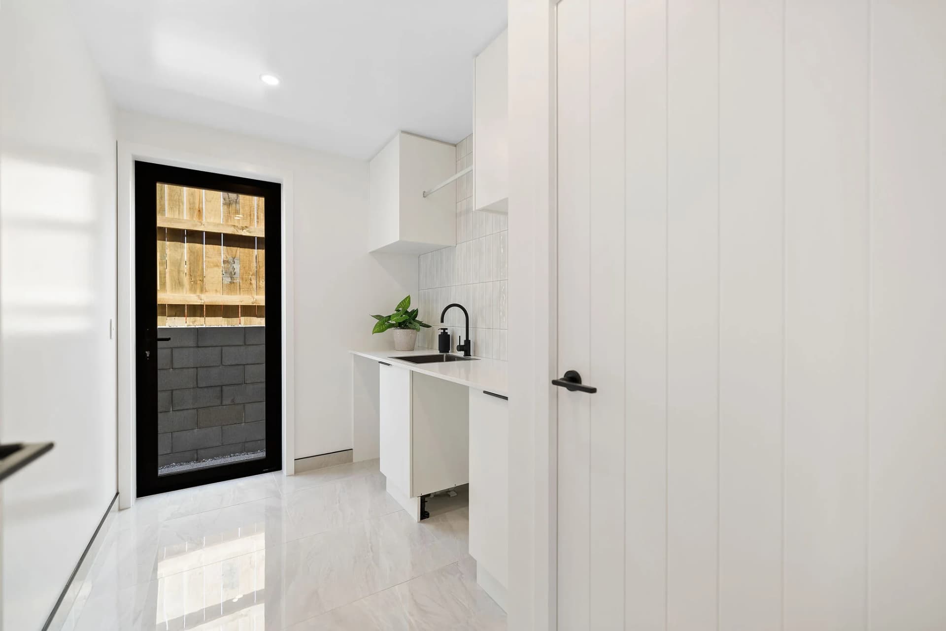 Classic kitchen with white shaker doors and timber flooring, NZ bespoke design
