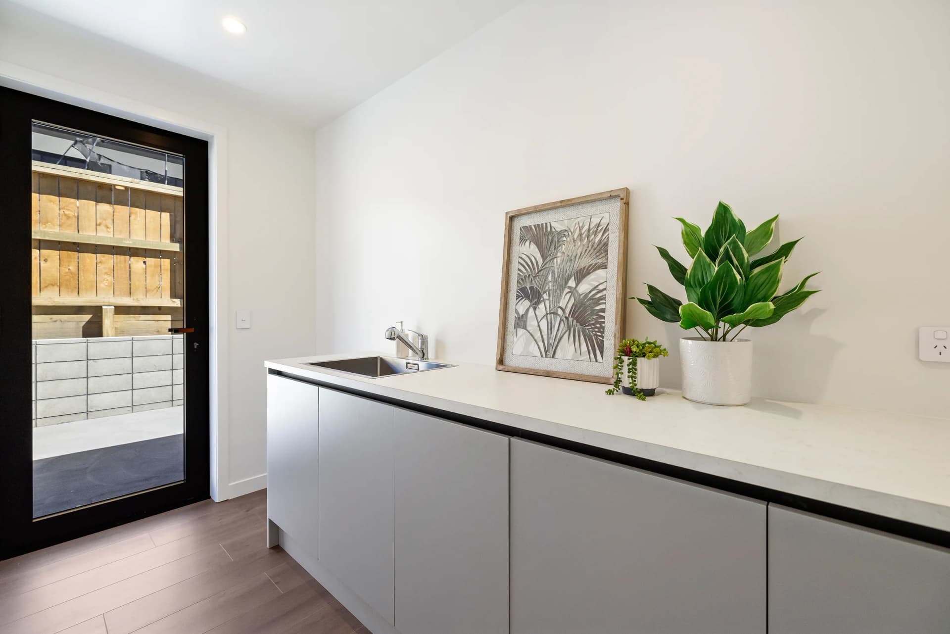 Contemporary handleless kitchen with soft grey cabinetry, Inspire Kitchens NZ